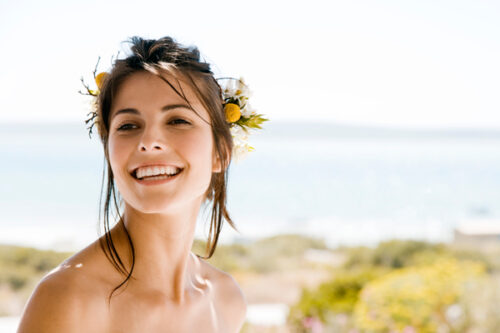 young girl smiling on the beach